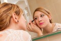 Girl Putting Makeup Royalty Free Stock Photo