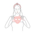 Girl putting treatment face sheet mask