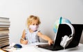 A girl in quarantine wearing a mask with a laptop is undergoing school training remotely