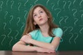 Girl With Question Mark Drawn On The Chalkboard