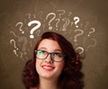 Girl with question mark symbols around her head Royalty Free Stock Photo