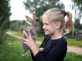 Girl and a rabbit in the village