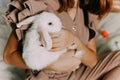 Girl and rabbits. Easter symbols, pets bunnies