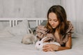 Girl and rabbits. Easter symbols, pets bunnies