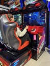 Woman driving a racing game. Girl on a racing car simulator. Concept: computer games, car racing. Kyiv, Galaxy amusement park, Royalty Free Stock Photo