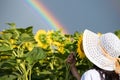 Girl Rainbow Flowers. girl in the field holding a bouquet of sunflowers. Royalty Free Stock Photo