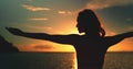 Girl raised hands enjoy bright sea sunset Royalty Free Stock Photo