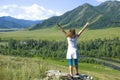 The girl with the raised hands in Mountains Altai Russia the top view Royalty Free Stock Photo