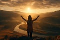 The girl raised her hands to the sun against the backdrop of the mountains. Healthy lifestyle, travel concept