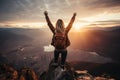 The girl raised her hands to the sun against the backdrop of the mountains. Healthy lifestyle, travel concept