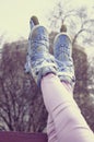 Girl raised legs up wearing roller skates