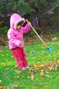 Girl raking leaves