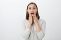 Girl reacting to awesome surprise being pleased and delighted, lucky to have cool friends. Portrait of charming woman Royalty Free Stock Photo