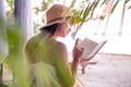 Girl reading a book on the beach Royalty Free Stock Photo