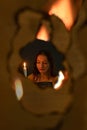 Girl Reading Book In Candle Light through Flames Royalty Free Stock Photo