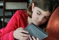 Girl Reading Book on E-Reader Royalty Free Stock Photo
