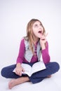 Girl reading a book and having an idea Royalty Free Stock Photo