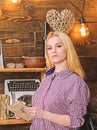 Girl reading book in house of gamekeeper. Girl in casual outfit in wooden vintage interior enjoy poetry. Lady blonde on