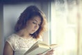 Girl reading a book isolated oriental