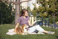 Girl reading a book on the lawn Royalty Free Stock Photo