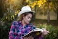 Girl reading book in park