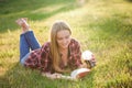 Girl reading a book in park, woman, green Royalty Free Stock Photo