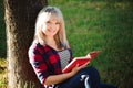 Girl reading a book in park, woman, green Royalty Free Stock Photo