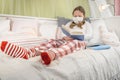 Girl reading a book during quarantine on the bed