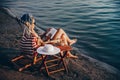 Girl reading a book while sitting on deck chair Royalty Free Stock Photo