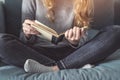 Girl reading a book on sofa Royalty Free Stock Photo