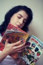 Girl reading comics Royalty Free Stock Photo