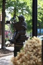 Girl reading in commercial area - sculpture