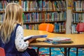 A girl reading at a library