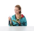 Girl reading a love note. Royalty Free Stock Photo