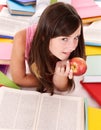 Girl reading pile colored book.