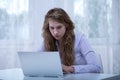 Girl reading rumor on internet Royalty Free Stock Photo