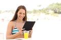 Girl reading a tablet or ebook on summer holidays