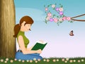 Girl reads book sitting in the meadow Royalty Free Stock Photo