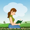 Girl reads book sitting in the meadow Royalty Free Stock Photo