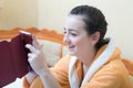 Girl reads a message from the tablet Royalty Free Stock Photo