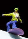 Girl ready to slide with snowboard at night Royalty Free Stock Photo