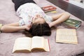 Girl realxed in her romm, without books