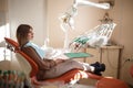 Girl on reception at the dentist. Beautiful room