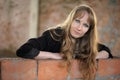 Girl recline on wall