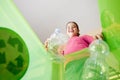 Girl recycling plastic bottles Royalty Free Stock Photo