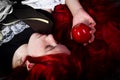 Girl with red apple in a poetic representation