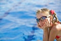 Girl in red bikini, glasses near swimming pool. Royalty Free Stock Photo