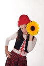 Girl in a red cap with a sunflower Royalty Free Stock Photo