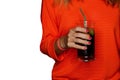 A girl in red clothes holds a glass of alcoholic beverage on white isolated background Royalty Free Stock Photo