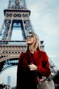 Girl in red coat and bag at parisian street Royalty Free Stock Photo